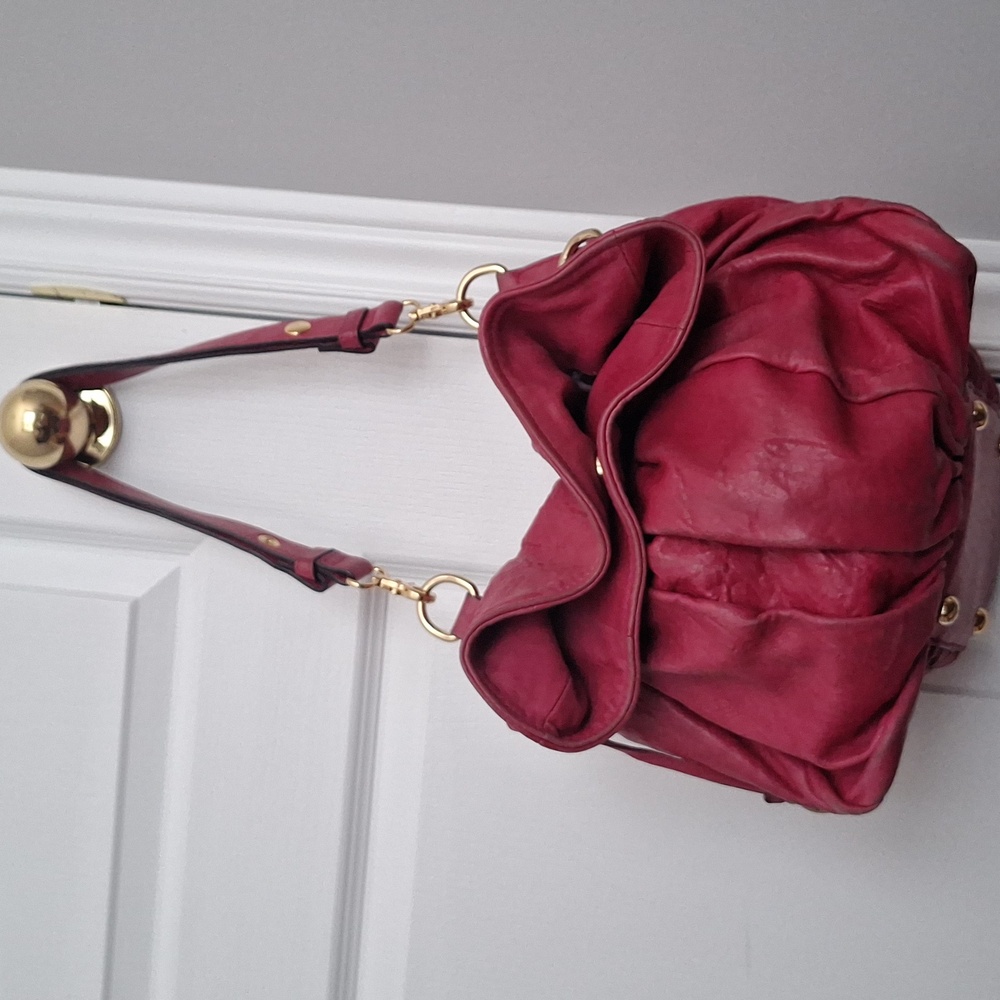 Pink adjustable strap leather bag